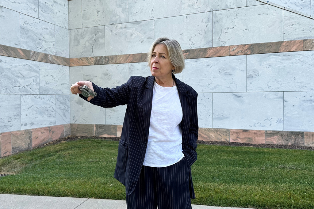 Noelle McAfee, an Emory University professor, talks about her lawsuit against the school over her 2024 arrest at a protest over the Israel-Hamas war on Thursday, April 23, 2026, on the Emory University campus in Atlanta. (AP Photo/Jeff Amy)