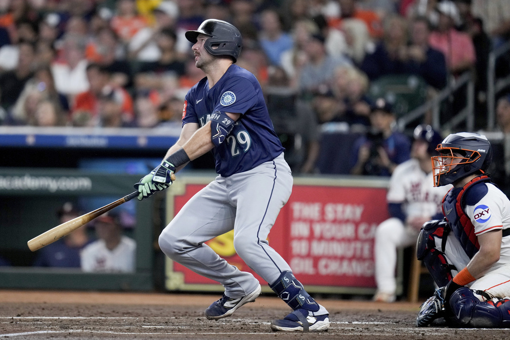 Seattle Mariners' Cal Raleigh (29) watches his solo home run against the Houston Astros during the third inning of a baseball game Saturday, Sept. 20, 2025, in Houston. (AP Photo/Eric Christian Smith)