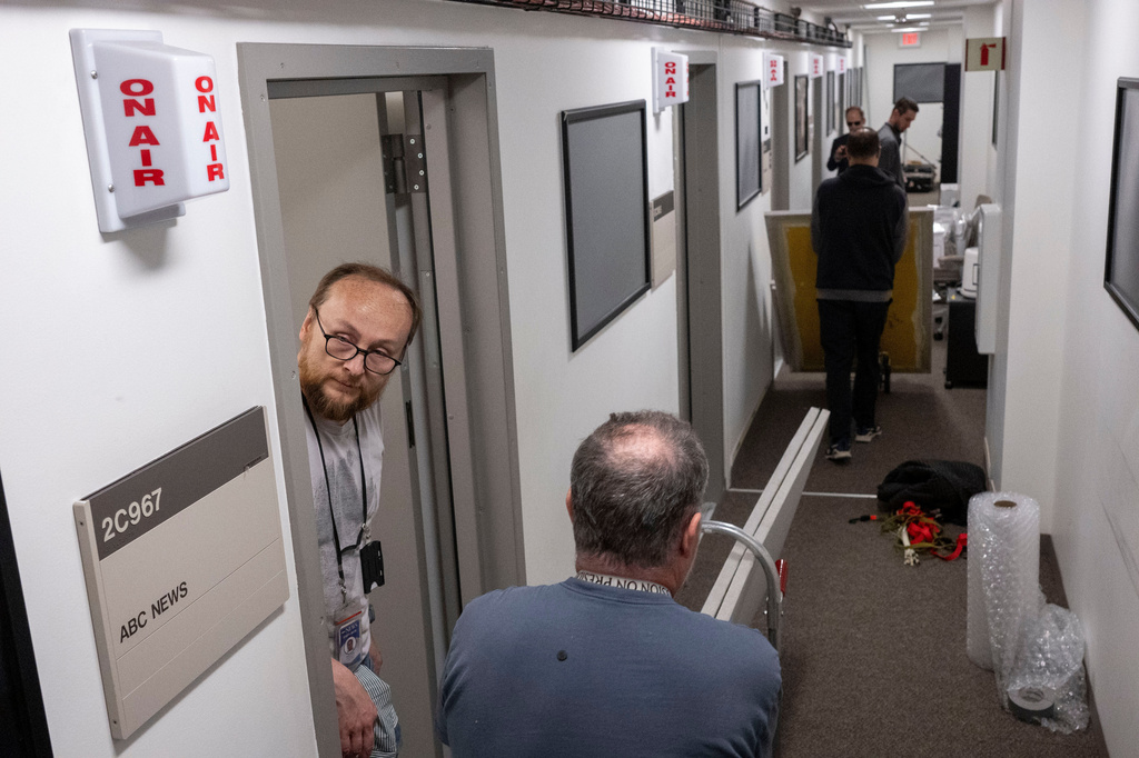 FILE - Members of the media pack up their belongings in the press area of the Pentagon, Wednesday, Oct. 15, 2025 in Washington. (AP Photo/Kevin Wolf, File)