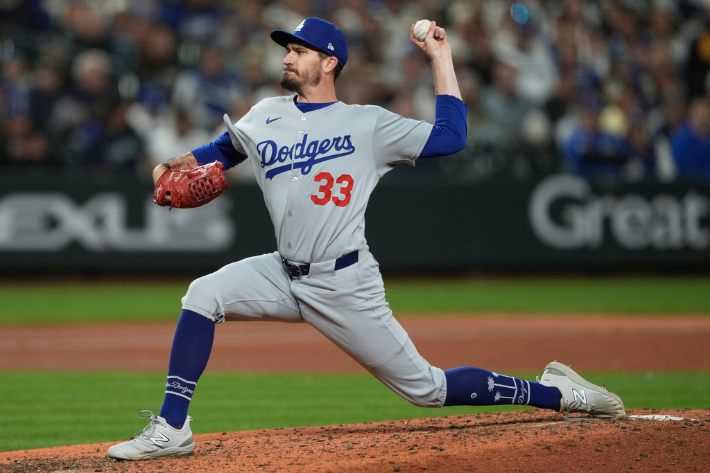 FILE - Los Angeles Dodgers relief pitcher Andrew Heaney throws during the fifth inning of a baseball game against the Seattle Mariners, Saturday, Sept. 27, 2025, in Seattle. (AP Photo/Ryan Sun, File)