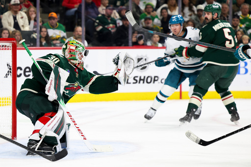 Minnesota Wild goaltender Jesper Wallstedt (30) saves the puck with his mask during the second period of an NHL hockey game against the San Jose Sharks, Sunday, Oct. 26, 2025, in St. Paul, Minn. (AP Photo/Ellen Schmidt) Minnesota Wild goaltender Jesper Wallstedt (30) saves the puck with his mask during the second period of an NHL hockey game against the San Jose Sharks, Sunday, Oct. 26, 2025, in St. Paul, Minn. (AP Photo/Ellen Schmidt)