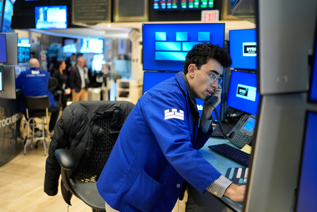 Alexander Weitzman works on the floor at the New York Stock Exchange in New York, Wednesday, March 25, 2026. (AP Photo/Seth Wenig)
