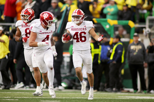 Indiana linebacker Isaiah Jones (46) celebrates after an interception with linebacker Aiden Fisher (4) during the second half of an NCAA college football game against Oregon, Saturday, Oct. 11, 2025, in Eugene, Ore. (AP Photo/Lydia Ely) Indiana linebacker Isaiah Jones (46) celebrates after an interception with linebacker Aiden Fisher (4) during the second half of an NCAA college football game against Oregon, Saturday, Oct. 11, 2025, in Eugene, Ore. (AP Photo/Lydia Ely)