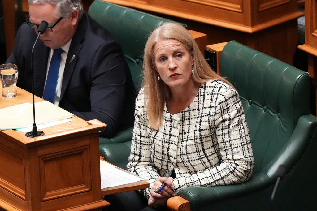 FILE - New Zealand Minister of Social Development Louise Upston watches a speech at Parliament in Wellington, New Zealand, on Aug. 19, 2026. (AP Photo/Charlotte Graham-McLay, File)