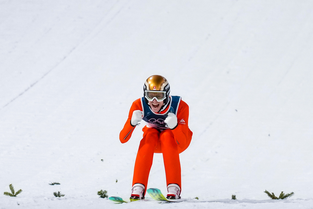 Gregor Deschwanden, of Switzerland, reacts after his first round jump of the ski jumping men's normal hill individual at the 2026 Winter Olympics, in Predazzo, Italy, Monday, Feb. 9, 2026. (AP Photo/Evgeniy Maloletka)