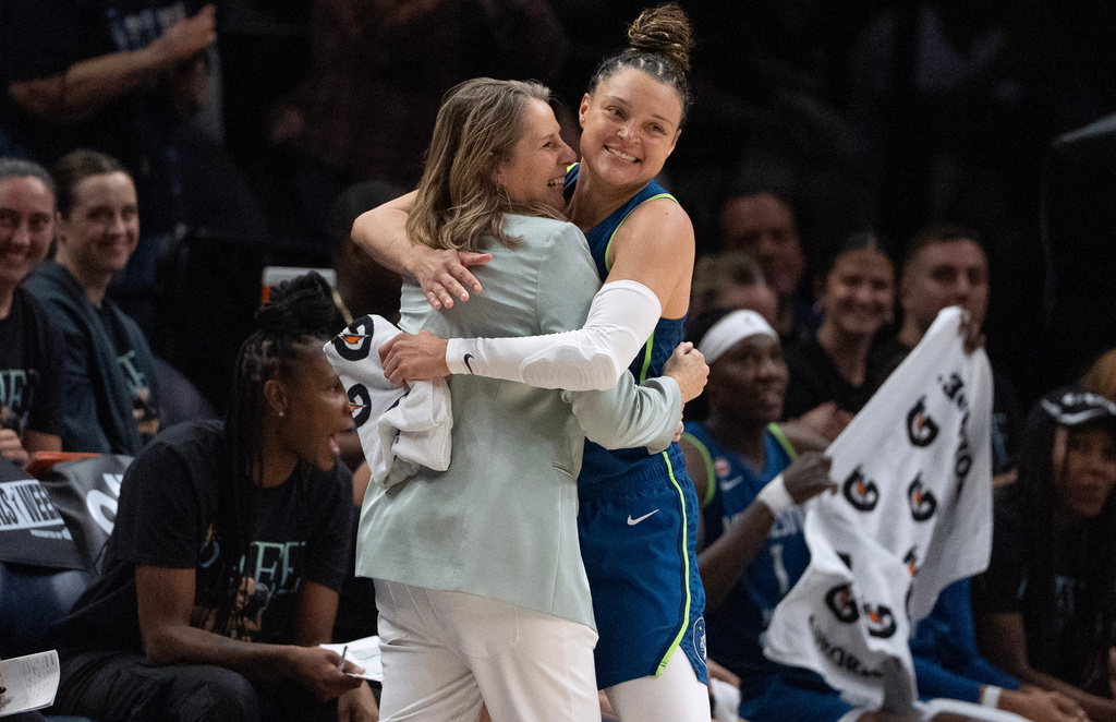 Minnesota Lynx guard Kayla McBride, right, hugged head coach Cheryl Reeve during a basketball game, Sunday Aug. 9, 2026 in Minneapolis. (Jerry Holt/Minnesota Star Tribune via AP)