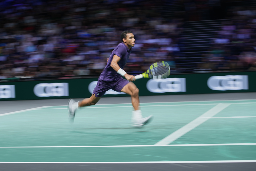 Canada's Felix Auger-Aliassime runs during quarterfinal match of the Paris Masters tennis tournament against Monaco's Valentin Vacherot in Paris, Friday, Oct. 31, 2025. (AP Photo/Christophe Ena)