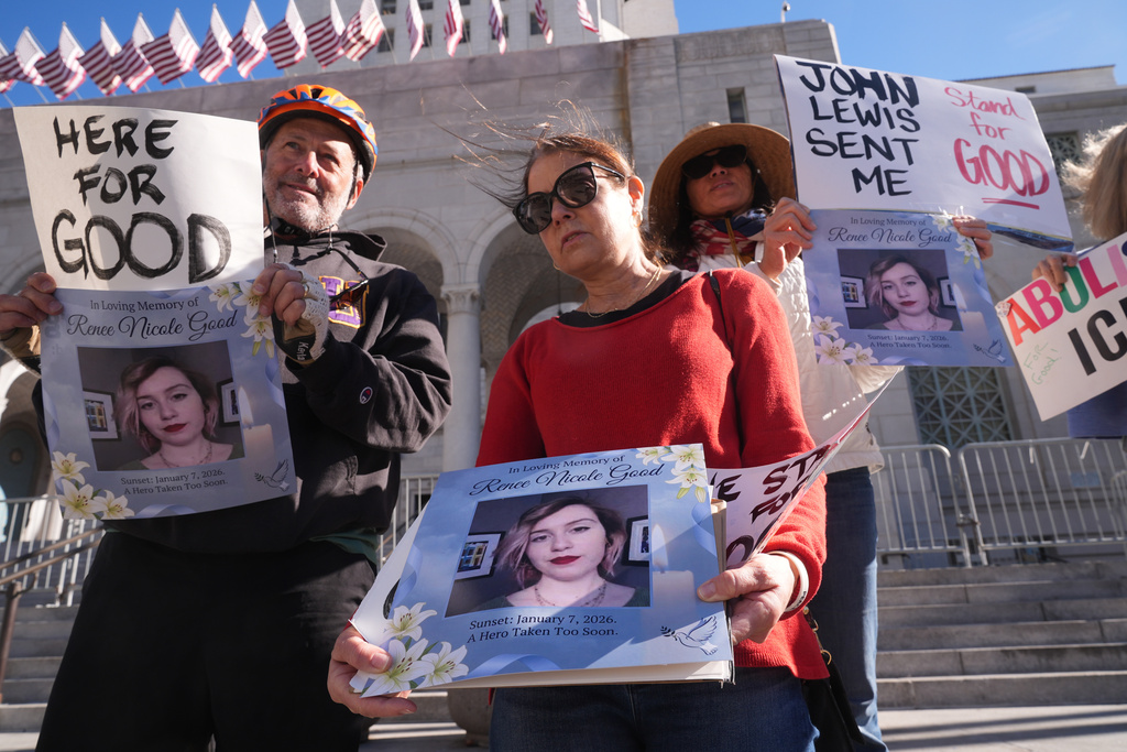 Demonstrators gather in remembrance for Renee Good, a Minneapolis woman who was shot and killed by an Immigration and Customs Enforcement officer in Minnesota, Thursday, Jan. 8, 2026, in Los Angeles. (AP Photo/Damian Dovarganes)