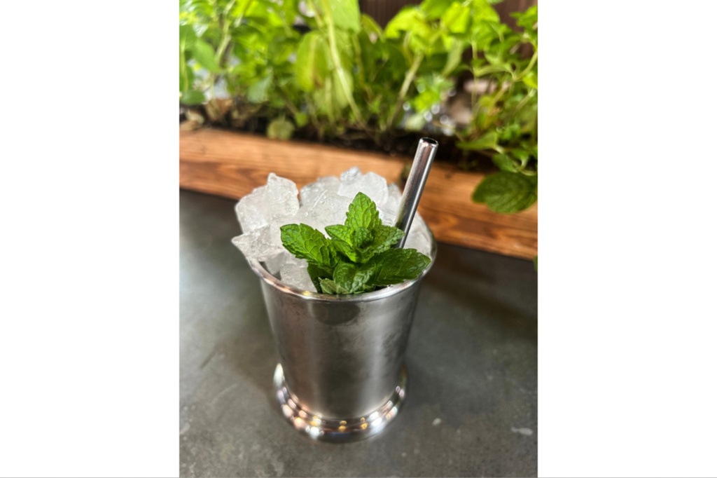 A Mint Julep cocktail is displayed at the cocktail bar Cato in London on April 22, 2026. (AP Photo/Louise Dixon)