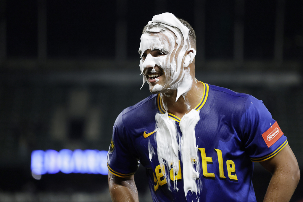Seattle Mariners' Harry Ford celebrates with a face full of shaving cream his walkoff sacrifice fly against the Los Angeles Angels hit during the 12th inning of a baseball game Thursday, Sept. 11, 2025, in Seattle. (AP Photo/John Froschauer)