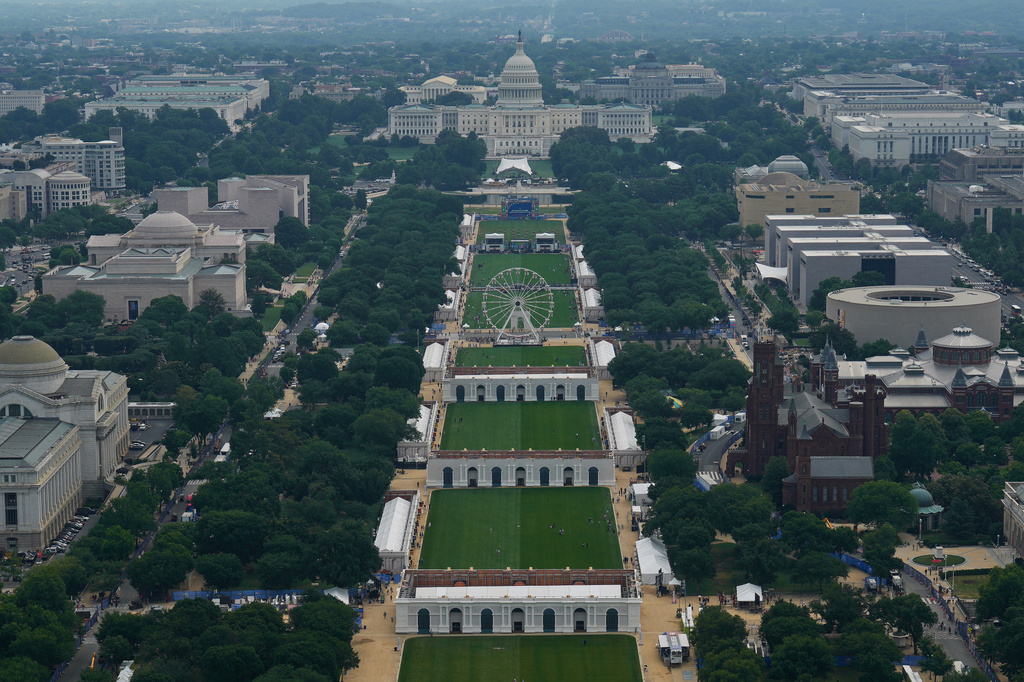 The Freedom 250 Ferris Wheel and the U.S. Capitol are seen on the National Mall from the Washington Monument during the Great American State Fair on Friday, June 26, 2026, in Washington. (AP Photo/Carolyn Kaster)