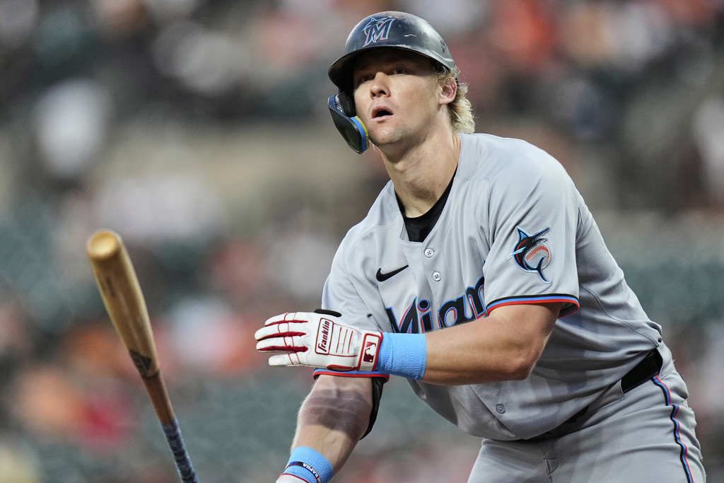 Miami Marlins' Kyle Stowers tosses his bat after being walked by Baltimore Orioles starting pitcher Dean Kremer during the fourth inning of a baseball game Friday, July 11, 2025, in Baltimore. (AP Photo/Stephanie Scarbrough)