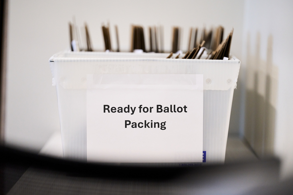 Absentee ballots ready to be packed into envelopes sit in a bin at the Wake County Board of Elections on Thursday, Sept. 3, 2026, in Raleigh, N.C. (AP Photo/Matt Ramey)