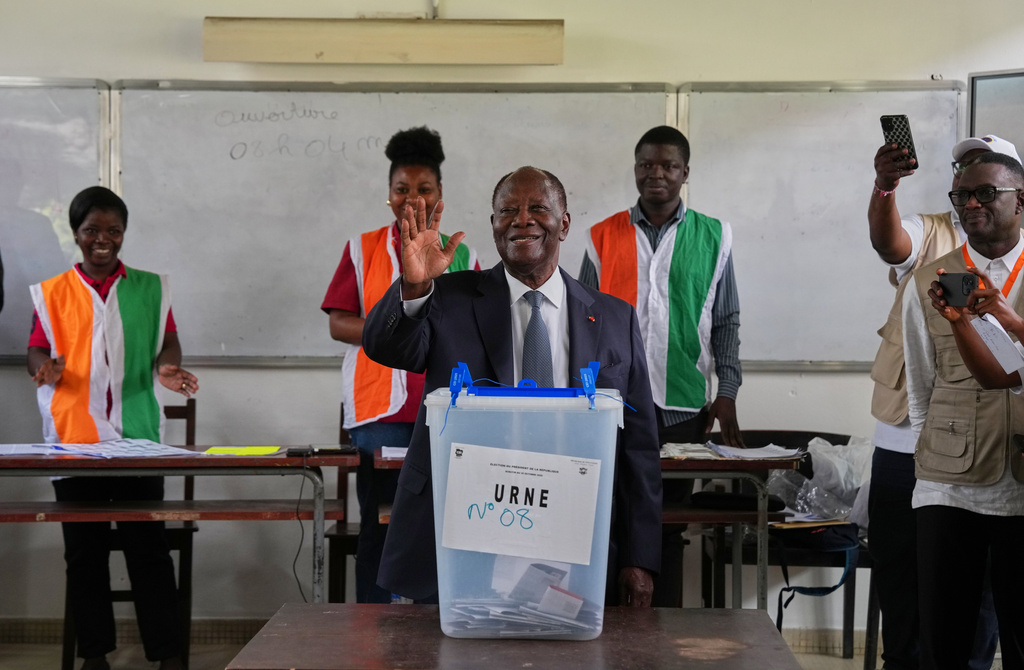 Ivory Coast President Alassane Ouattara casts his vote at a polling station during the presidential elections in Abidjan, Ivory Coast, Saturday, Oct. 25, 2025. (AP Photo/Misper Apawu)