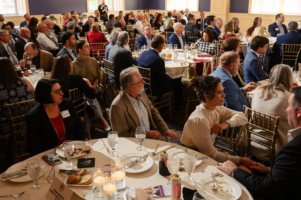 Guests look on as candidates speak on stage during the Kenton County Republican Party Lincoln Day Dinner, Thursday, April 30, 2026, in Covington, Ky. (AP Photo/Jon Cherry)