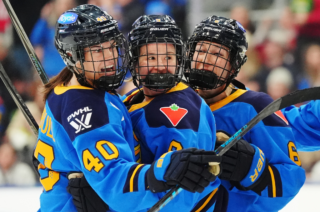FILE - Toronto Sceptres' Blayre Turnbull (40) celebrates her goal against the Montreal Victoire with Daryl Watts, center, and Kali Flanagan (6) during the second period of an PWHL hockey game in Toronto, Tuesday, March 3, 2026. (Frank Gunn/The Canadian Press via AP,File)