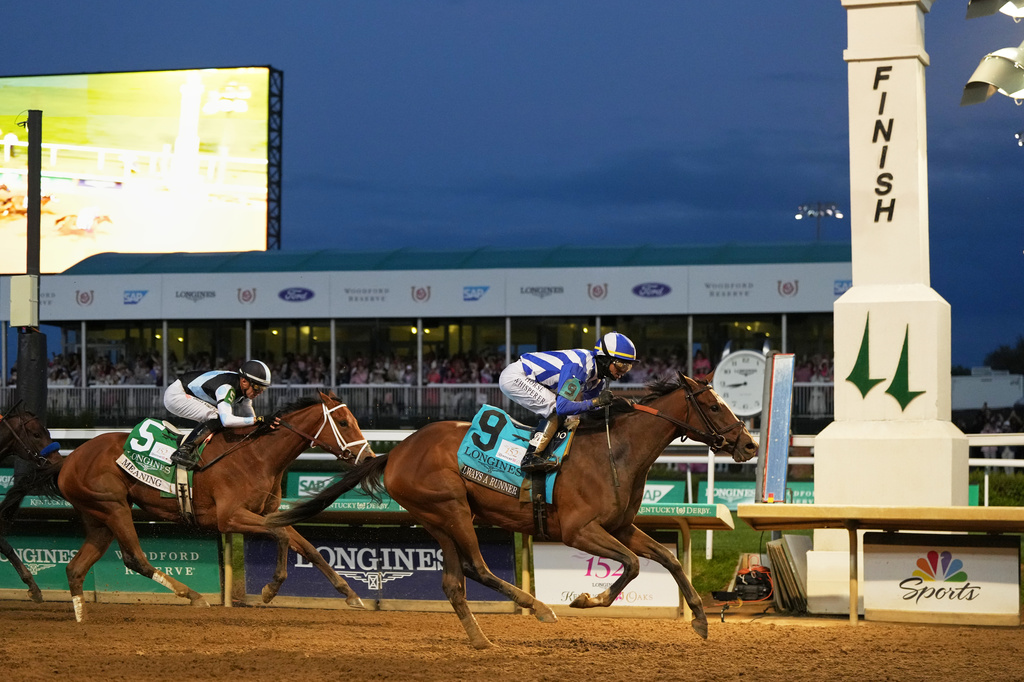 Always a Runner (9) ridden by Jose L. Ortiz wins the 152nd running of the Kentucky Oaks followed by Meaning (5) ridden by Juan J. Hernandez horse race at Churchill Downs, Friday, May 1, 2026, in Louisville, Ky. (AP Photo/Jeff Roberson)