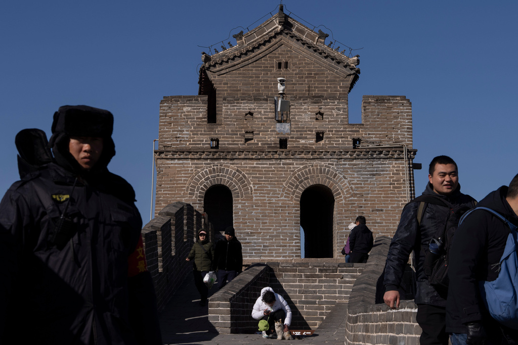 A security camera monitors visitors to the Great Wall of China on the outskirts of Beijing, Tuesday, Feb. 25, 2025. (AP Photo/Ng Han Guan)