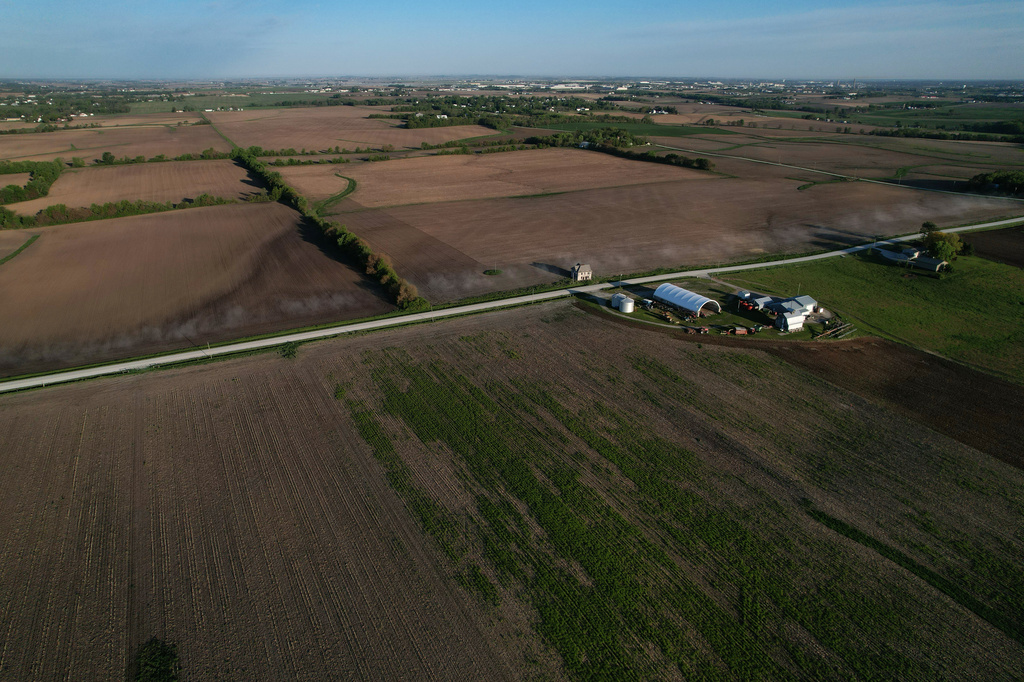 This photo shows farmland Friday, May 8, 2026, near Ely, Iowa. (AP Photo/Brittany Peterson)