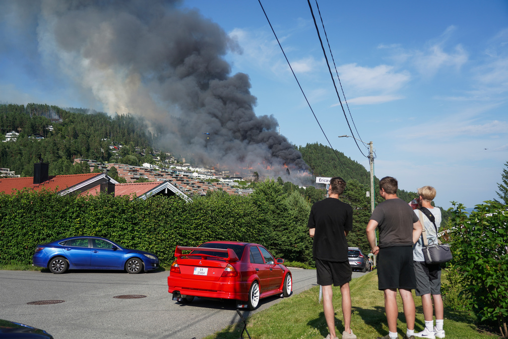 Smoke rises over terraced houses on fire in the Krokstadelva village in Drammen, Norway, Friday. July 17, 2026. (Thomas Fure/NTB Scanpix via AP)