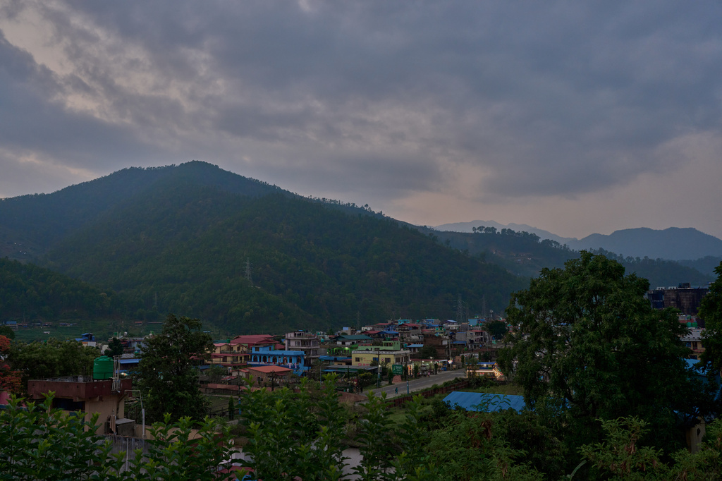 Colorful buildings sit along a main road in Hetauda, Nepal, Thursday, May 14, 2026. (AP Photo/Bram Janssen)