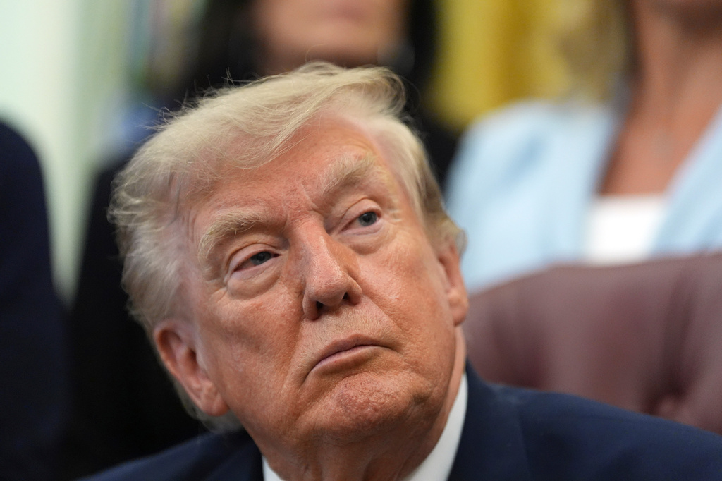 President Donald Trump listens during a meeting about military families, in the Oval Office of the White House, Monday, Aug. 3, 2026, in Washington. (AP Photo/Alex Brandon)