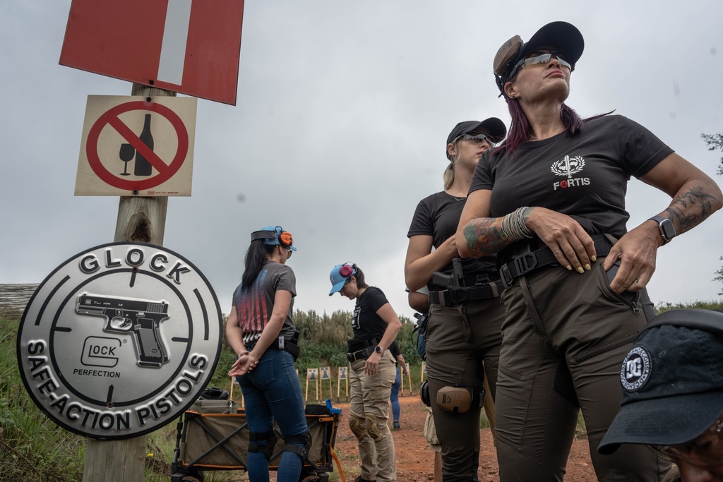 A women only group prepares for training at the Out There Sport Shooting Range in Bronkhorstspruit, Pretoria, South Africa, Saturday, Jan. 24, 2026. (AP Photo/Jacques Nelles)