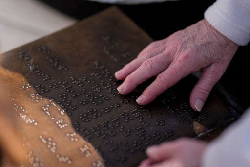 Phyllis Clopton, of Talladega, Ala., reads braille on a newly unveiled statue of Helen Keller on the grounds of the Alabama State Capitol, Friday, Oct. 24, 2025, in Montgomery, Ala. (AP Photo/Mike Stewart) Phyllis Clopton, of Talladega, Ala., reads braille on a newly unveiled statue of Helen Keller on the grounds of the Alabama State Capitol, Friday, Oct. 24, 2025, in Montgomery, Ala. (AP Photo/Mike Stewart)