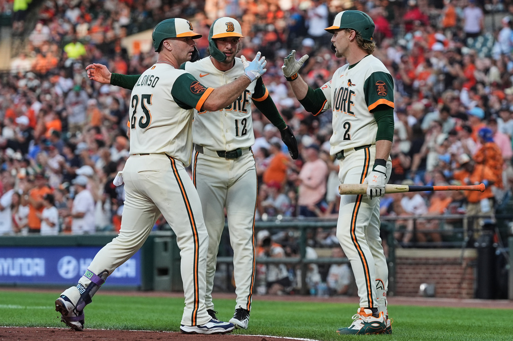 Baltimore Orioles' Pete Alonso (25) celebrates with Dylan Beavers (12) and Gunnar Henderson (2) after hitting a two-run home run during the first inning of a baseball game against the Philadelphia Phillies, Friday, July 31, 2026, in Baltimore. (AP Photo/Stephanie Scarbrough)