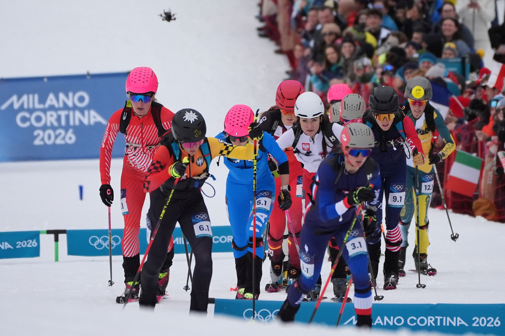 France's Emily Harrop, foreground, leads the group during a ski mountaineering mixed relay, at the 2026 Winter Olympics, in Bormio, Italy, Saturday, Feb. 21, 2026.(AP Photo/Rebecca Blackwell)