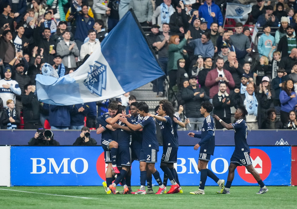 Vancouver Whitecaps' Brian White, second left, celebrates his goal against Toronto FC with his teammates during the first half of an MLS soccer match, in Vancouver, on Saturday, Feb. 28, 2026. (Darryl Dyck/The Canadian Press via AP)