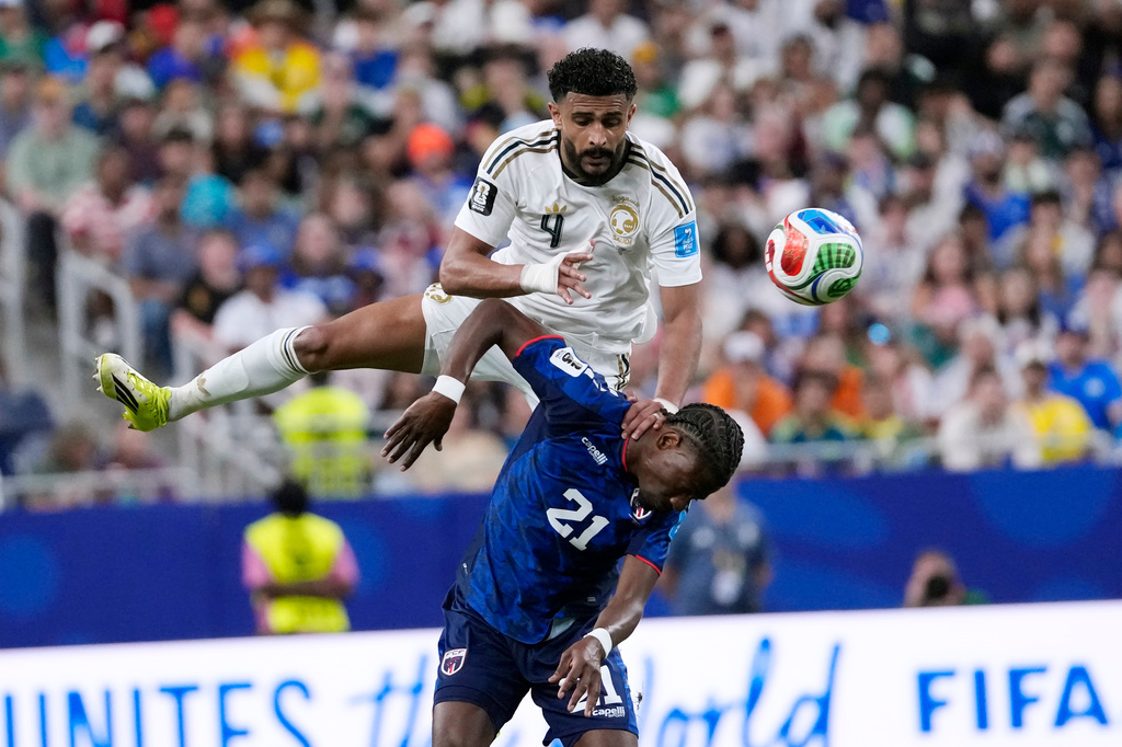 Saudi Arabia's Abdulelah Alamri (4) and Cape Verde's Nuno da Costa (21) collide was they try to head the ball during the second half of the World Cup Group H soccer match in Houston, Friday, June 26, 2026. (AP Photo/David J. Phillip)