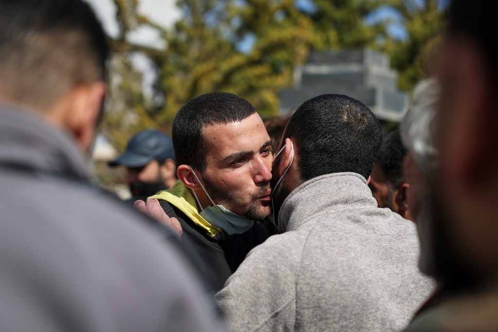 Two Syrian government prisoners embrace after being released in a prisoner exchange between Syrian government forces and Druze militiamen in Sweida province, Syria, Thursday, Feb. 26, 2026. (AP Photo/Ghaith Alsayed)