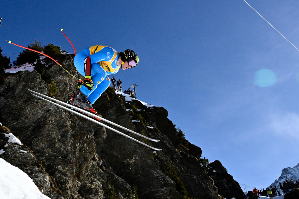 Giovanni Franzoni of Italy takes a jump during the alpine ski, men's World Cup super-G race, in Wengen, Switzerland, Friday, Jan. 16, 2026. (Jean-Christophe Bott/Keystone via AP)
