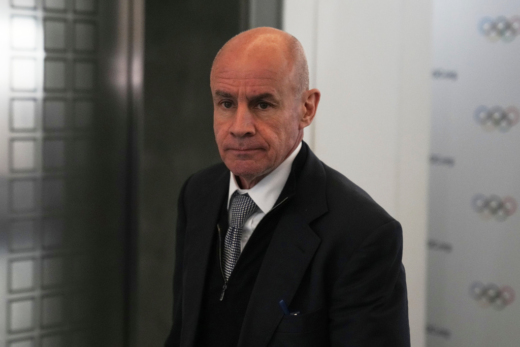 FILE - Candidate to the presidency of the International Olympic Committee Johan Eliasch arrives at the mixed zone during a break of the 144th session, which will elect the new IOC President, in Costa Navarino, western Greece, March 19, 2025. (AP Photo/Thanassis Stavrakis, File)