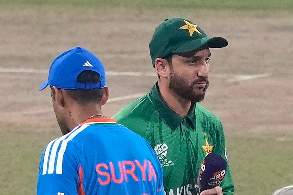India's captain Suryakumar Yadav, left, and Pakistan's captain Salman Ali Agha walk past each other after the coin toss of the T20 World Cup cricket match between India and Pakistan in Colombo, Sri Lanka, Sunday, Feb. 15, 2026. (AP Photo/Eranga Jayawardena)