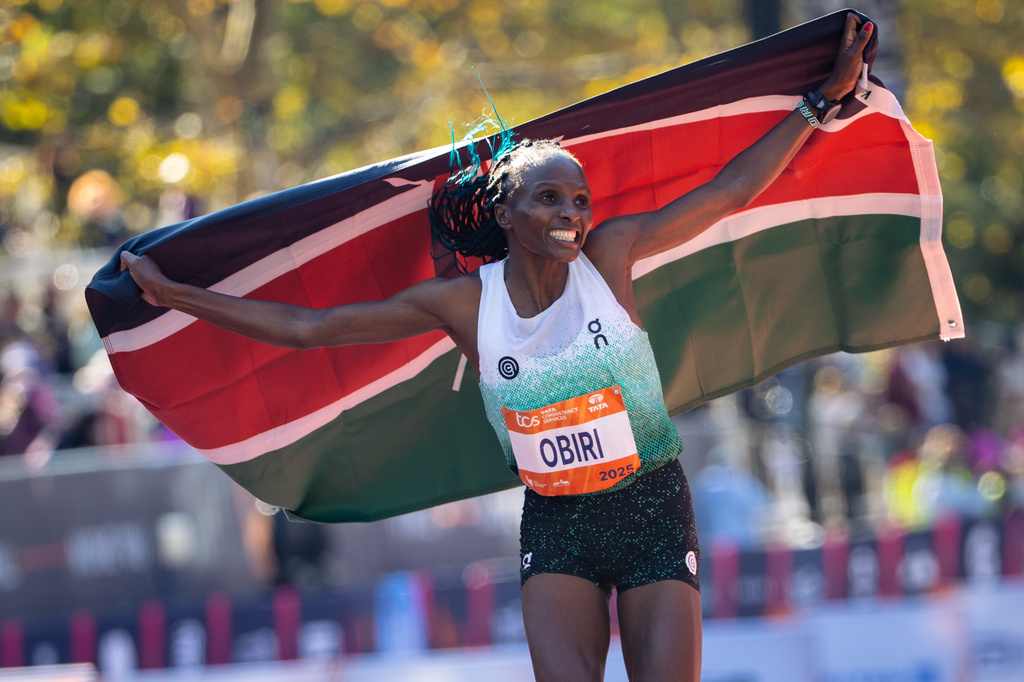 FILE - Hellen Obiri celebrates winning first place in the women's elite division of the New York City Marathon, Sunday, Nov. 2, 2025, in New York. (AP Photo/Angelina Katsanis, File)
