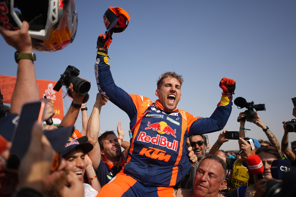 Rider Luciano Benavides of Argentina celebrates after the thirteenth stage with a start and finish in Yanbu, Saudi Arabia, Saturday, Jan.17, 2026. (AP Photo/Thibault Camus)