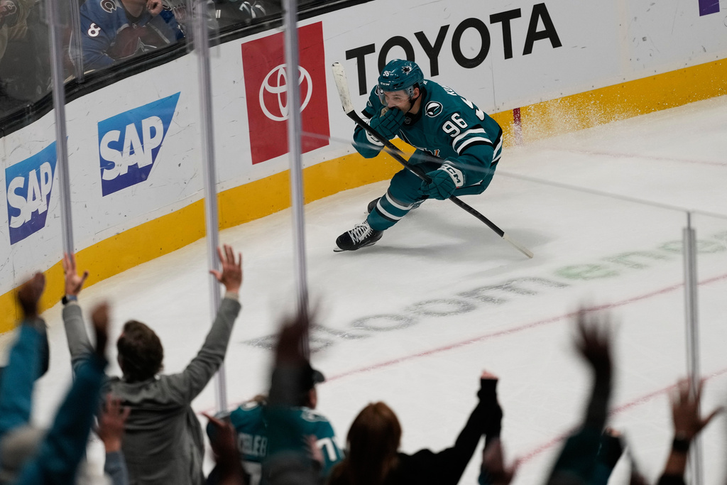 San Jose Sharks center Philipp Kurashev (96) celebrates after scoring the winning goal during overtime of an NHL hockey game against the Colorado Avalanche in San Jose, Calif., Saturday, Nov. 1, 2025. (AP Photo/Jeff Chiu)