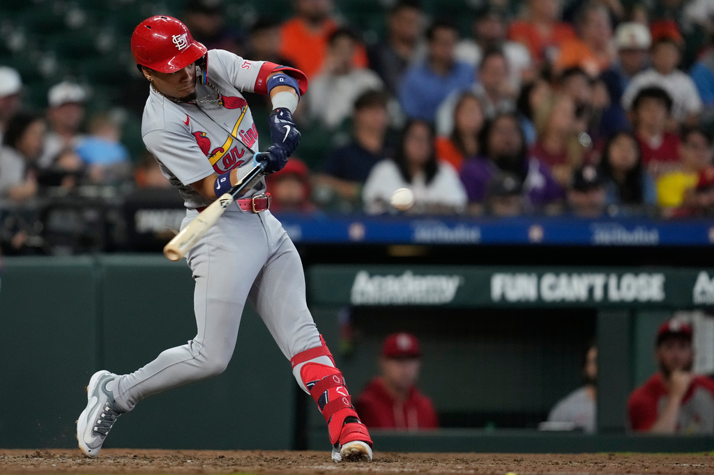 St. Louis Cardinals' Masyn Winn doubles during the tenth inning of a baseball game against the Houston Astros in Houston, Sunday, April 19, 2026. (AP Photo/Ashley Landis)