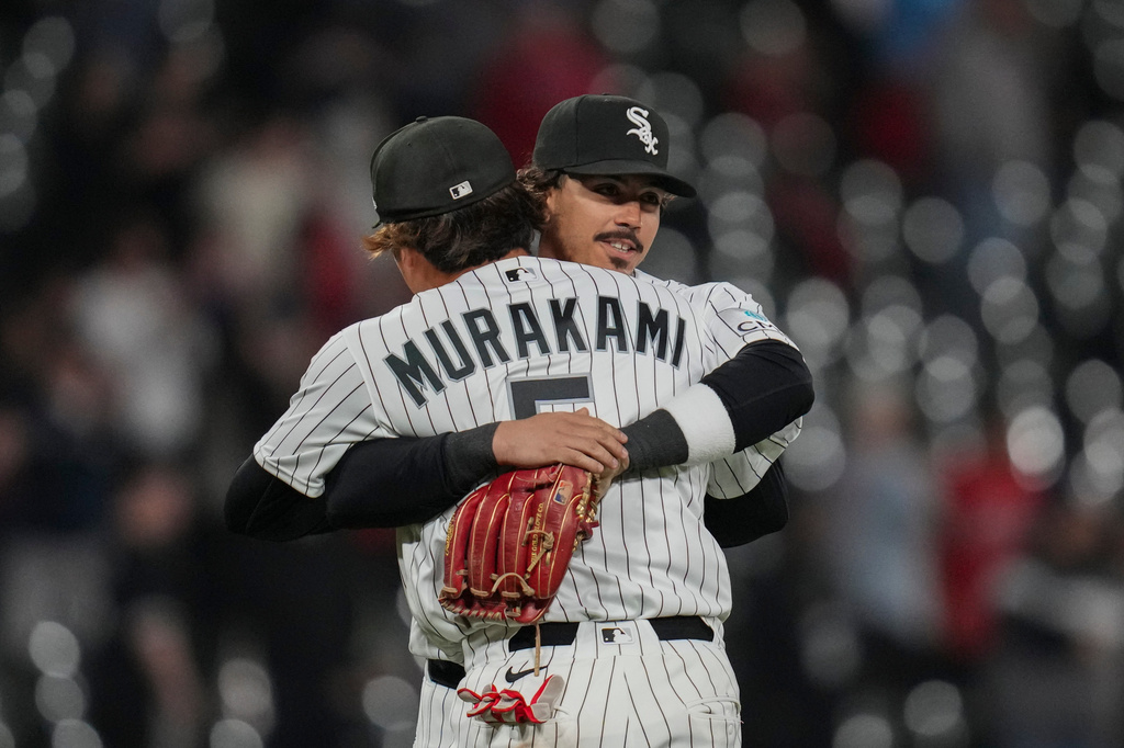 Chicago White Sox third baseman Miguel Vargas, right, hugs first baseman Munetaka Murakami as they celebrate their team's win over the Kansas City Royals in a baseball game Thursday, May 14, 2026, in Chicago. (AP Photo/Erin Hooley)