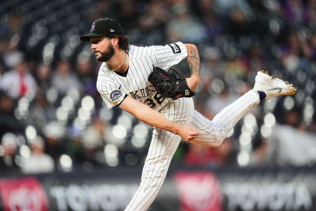 Colorado Rockies starting pitcher Mason Adams works against the Arizona Diamondbacks in the first inning of a baseball game Wednesday, Sept. 23, 2026, in Denver. (AP Photo/David Zalubowski)