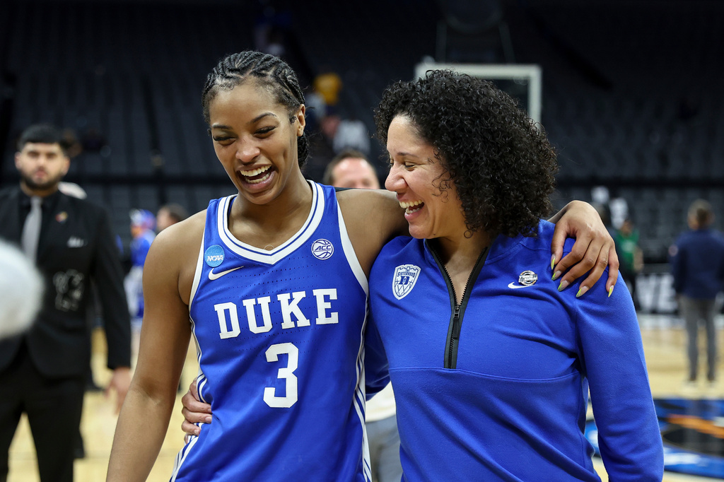 Duke guard Ashlon Jackson (3) and head coach Kara Lawson celebrate as they leave the court after the Sweet 16 of the NCAA college basketball tournament against LSU Friday, March 27, 2026, in Sacramento, Calif. (AP Photo/Sara Nevis)