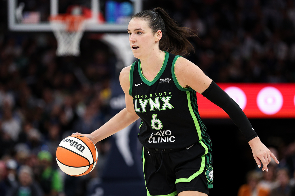 FILE - Minnesota Lynx forward Bridget Carleton (6) dribbles the ball up court against the Phoenix Mercury during the second half of Game 2 of a WNBA basketball playoff semifinals series Tuesday, Sept. 23, 2025, in Minneapolis. (AP Photo/Matt Krohn, File)