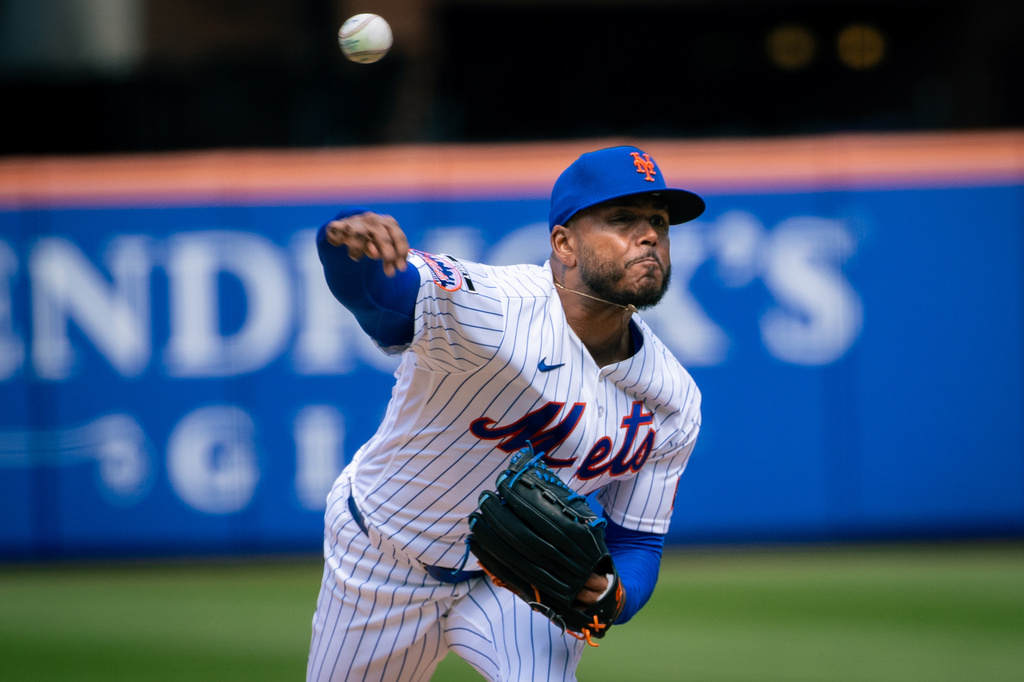 New York Mets pitcher Freddy Peralta (51) throws during the second inning of an opening-day baseball game against the Pittsburgh Pirates, Thursday, March 26, 2026, in New York. (AP Photo/Angelina Katsanis)