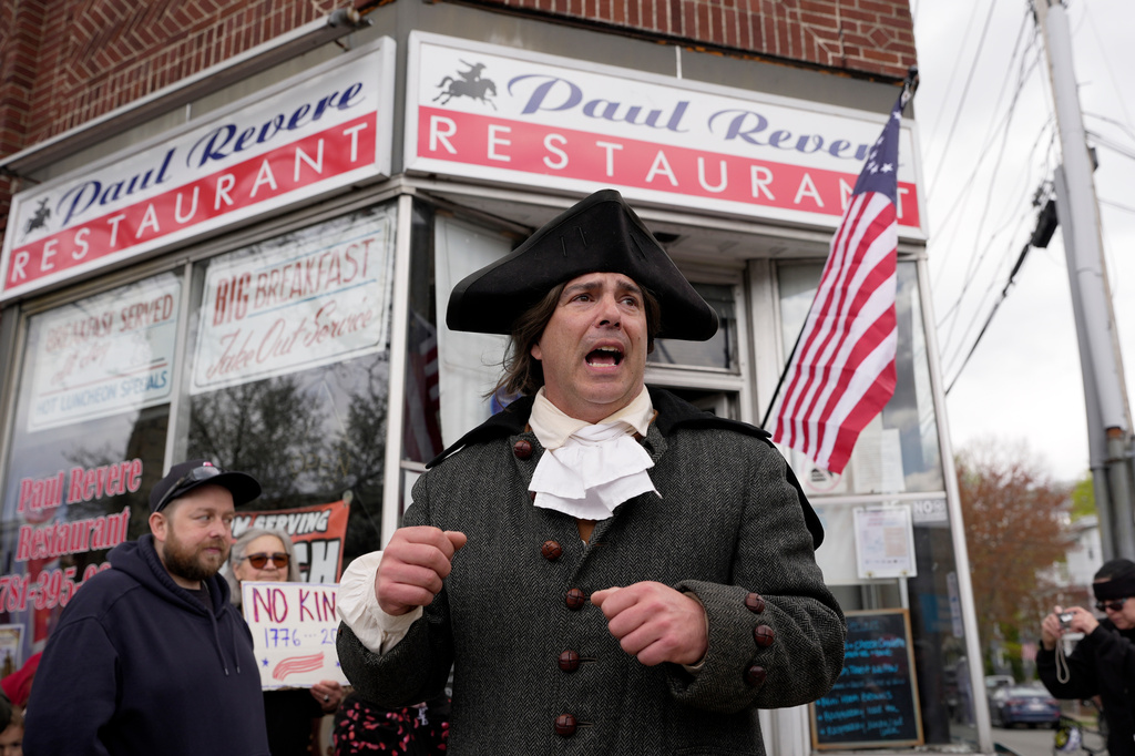 Brig. Gen. Richard Reale, dressed as American patriot Paul Revere, speaks to a crowd outside the Paul Revere Restaurant while reenacting the 1775 Boston-to-Lexington ride to alert colonists of approaching British troops, Monday, April 20, 2026, in Medford, Mass. (AP Photo/Robert F. Bukaty)