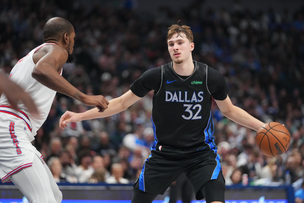 Dallas Mavericks forward Cooper Flagg, right, works the floor against Houston Rockets forward Kevin Durant during the second half of an NBA basketball game Saturday, Jan. 3, 2026, in Dallas. (AP Photo/Julio Cortez)
