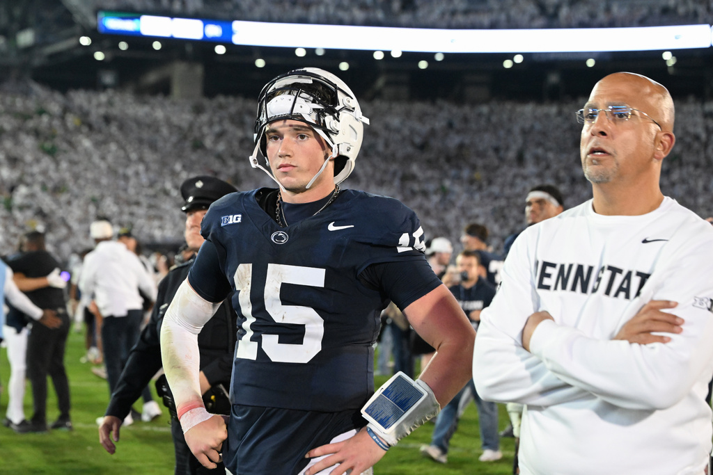 Penn State quarterback Drew Allar (15) and Penn State head coach James Franklin react after losing to Oregon in the second overtime of their NCAA college football game, Saturday, Sept. 27, 2025, in State College, Pa. (AP Photo/Barry Reeger)