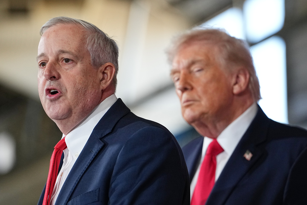 President Donald Trump listens as Michael Whatley speaks to soldiers and their families at Fort Bragg, N.C., Friday, Feb. 13, 2026. (AP Photo/Matt Rourke)
