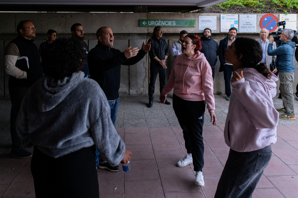 People gather outside a hospital where Noelia Castillo, a young Spanish woman, died after winning a long court fight for her right to euthanasia, in Sant Pere de Ribes, Spain, Thursday, March 26, 2026. (Lorena Sopena/Europa Press via AP)